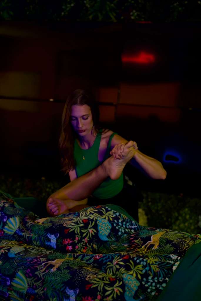 Ra'chelle performing foot restoration therapy